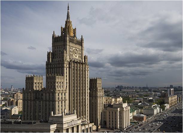 Cars drive past the Russian Foreign Ministry building in Moscow.